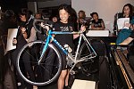Zang Toi with Lance Armstrong auction item